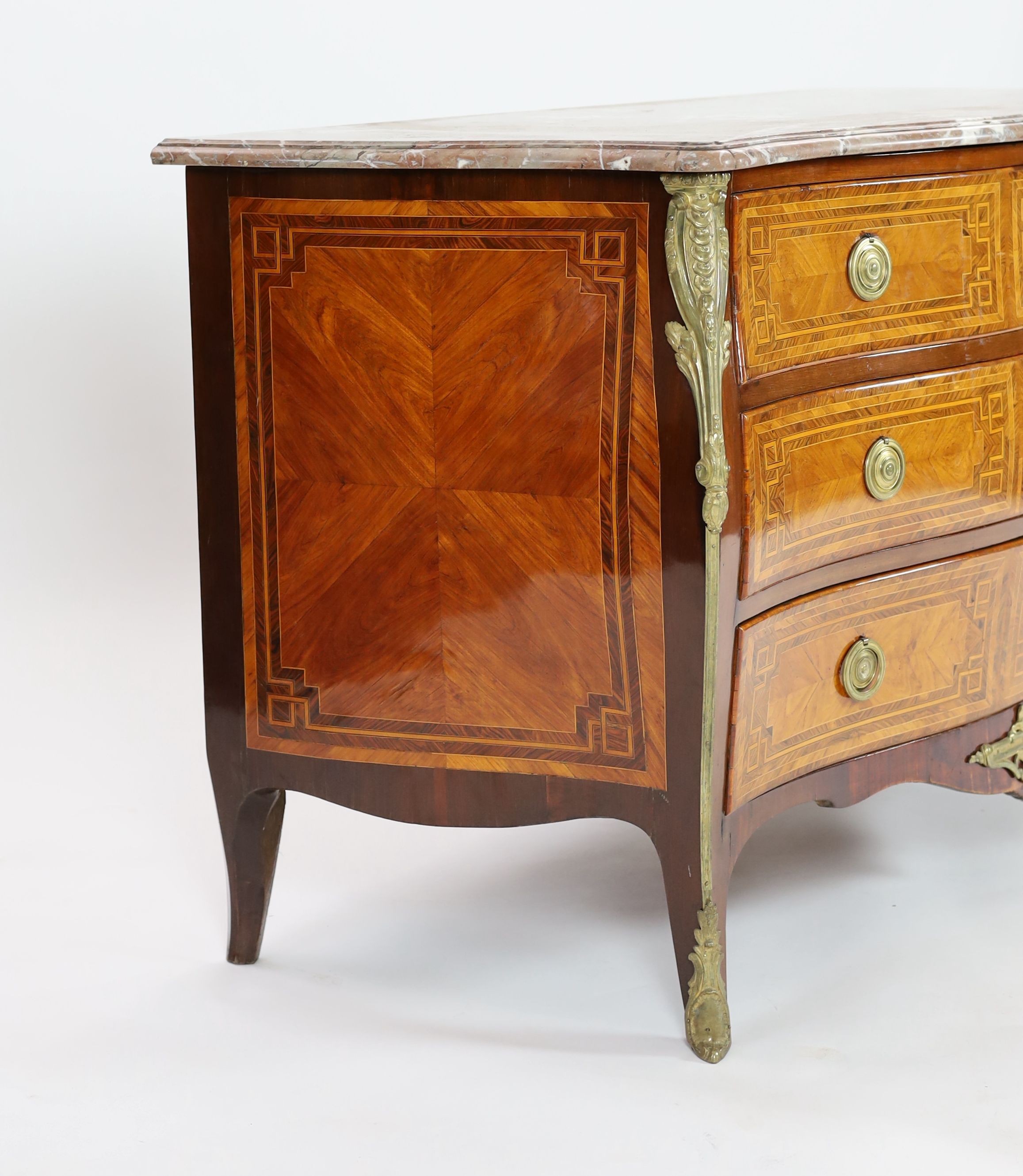 A late 18th century French banded kingwood serpentine marble top commode, width 148cm, depth 69cm, height 90cm